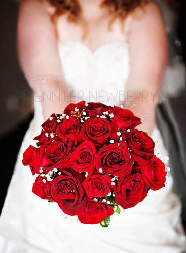 bride holding out flowers www.jnphotography.ca @filemanager